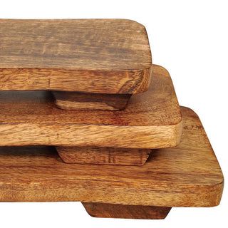 Close-up of natural wood grain detail on footed pedestal riser