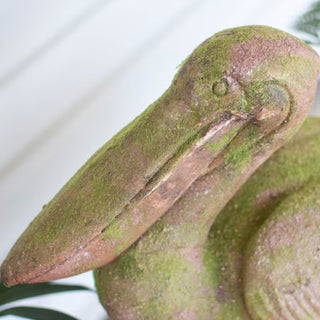 Close-up pelican statue weathered coastal home accent