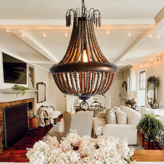 Boho wood bead chandelier in cozy living room