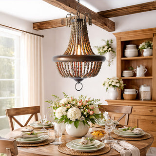 Rustic wood bead chandelier over farmhouse dining table