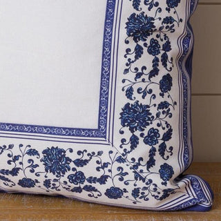 Decorative pillow with blue floral pattern on a white background