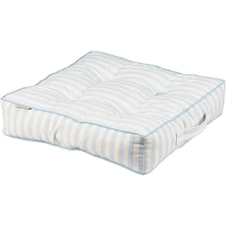 Blue striped seat cushion on built-in bench with bookshelf styling
