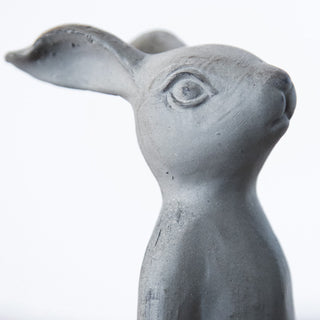 Close up distressed metal bunny statue