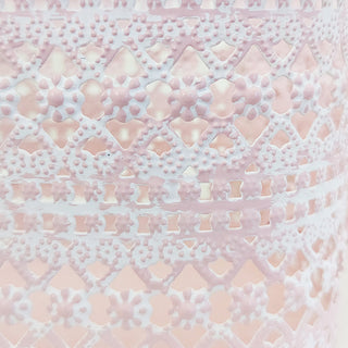 Pink perforated metal basket decorative texture detail