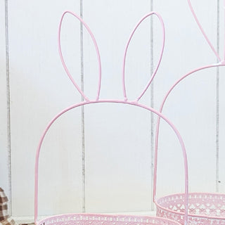 Pink metal bunny ear handle basket close-up