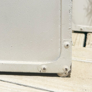 Planter corner detail showing distressed metal finish