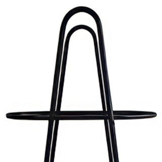 Close-up black metal plant stand top shelf
