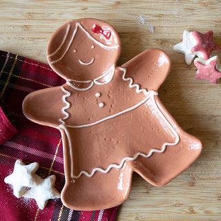Gingerbread girl plate on plaid holiday cloth