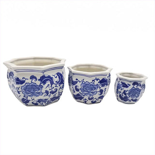 Side view of graduated ceramic pots with classic porcelain styling