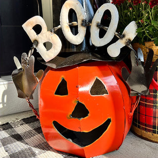 Close-up of smiling metal jack-o'-lantern pumpkin decoration