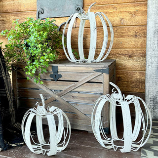 Set of three distressed white metal pumpkin decorations