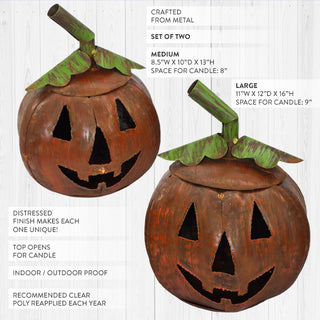 Product display of medium and large rustic metal jack-o’-lantern candle holders