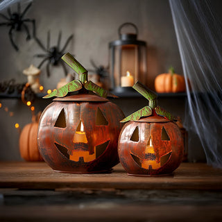 Set of two rustic metal pumpkin lanterns