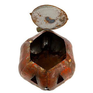 Open-top view of rustic metal pumpkin lantern