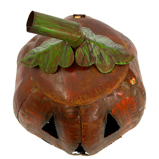 Close-up of distressed metal pumpkin lantern