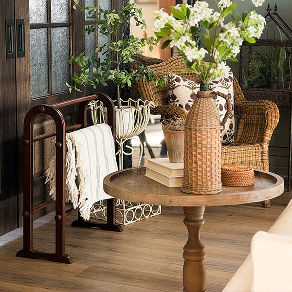 Wooden blanket ladder in cozy farmhouse living room