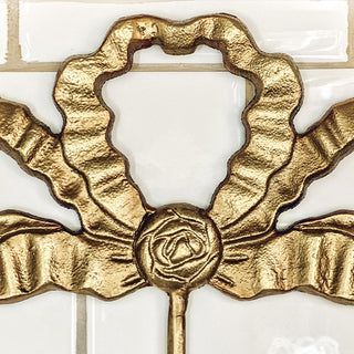 Close-up distressed brass cast iron decorative wall hook