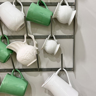 Metal wall rack with glass storage hooks