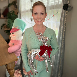 lady standing with reindeer