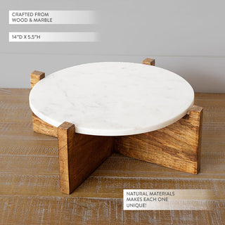 White marble top with natural veining on cross-base wood riser showing 14 inch diameter and 5.5 inch height dimensions