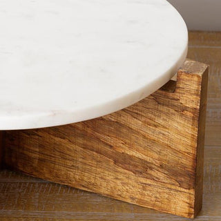  Close-up detail of rich wood grain on cross-base legs supporting white marble serving platform