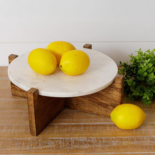 Marble and wood kitchen riser displaying fresh lemons with natural lighting and neutral farmhouse decor styling