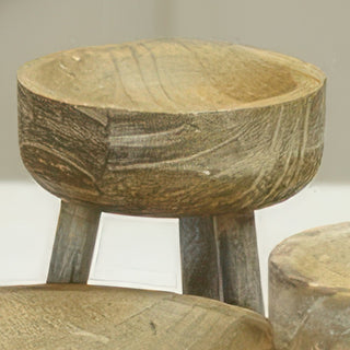 Three graduated wood risers styled with spring florals on porch