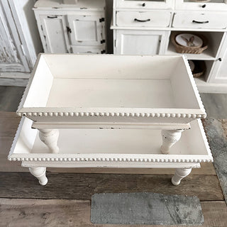 Distressed bead trim detail on white wood riser