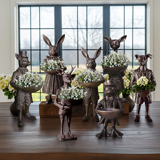 Complete Dapper Critters collection display with Royal Hare fox frog deer dog statues holding bowls with white flowers by window