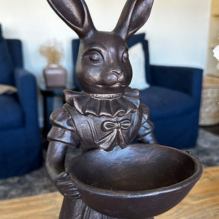 Close-up detail shot of Female Royal Hare face ruffled collar bow and bowl bronze oil finish resin craftsmanship