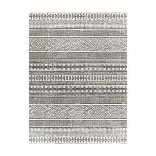 Patterned rug with geometric design on a white background