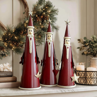 Set of three vintage-inspired red metal Santa figurines