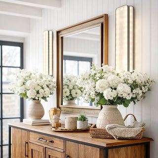 Rustic console table with mirror and floral home decor