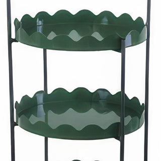 Close-up of green metal scalloped edge tiers on black frame tiered server stand