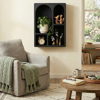 Modern black wall shelf styled cozy living room