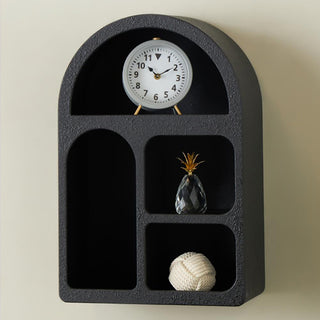 Black arched wall shelf with decor accents