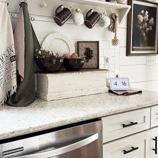 Farmhouse kitchen counter with distressed wooden shelf