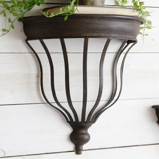 Close-up distressed metal wall shelf bracket detail