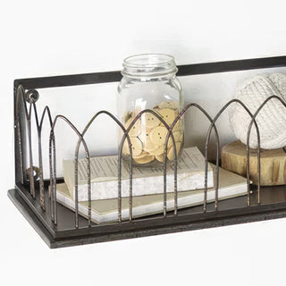 Detail shot of cathedral arch wire pattern on decorative metal wall shelf