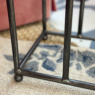 Base detail of distressed iron boot holder showing sturdy construction