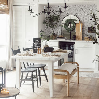 Dining room with a white table, chairs, and decorative elements. Decorated with the Spring Steal It Box