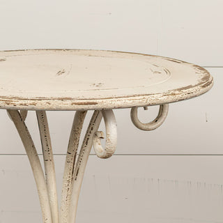 Close-up of distressed cream tabletop with vintage texture, farmhouse-style accent furniture