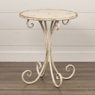 Full view of rustic cream metal accent table with distressed finish and curled legs for farmhouse decor