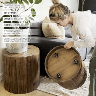Reclaimed wood drum table with hidden caster wheels