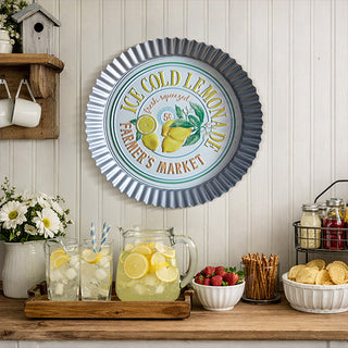 Vintage ice cold lemonade farmer's market metal wall sign displayed above refreshment station