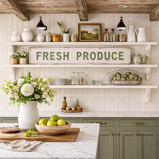 Vintage Fresh Produce embossed metal sign displayed in farmhouse kitchen with sage green cabinets and open shelving