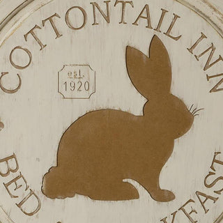 Close up detail of Cottontail Inn sign showing wood grain texture brown bunny silhouette with whiskers and est 1920 vintage farmhouse design element