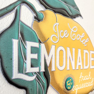 Close-up lemon leaf detail on metal wall art