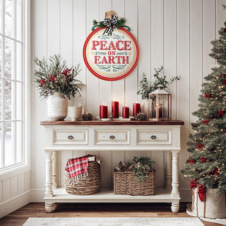  Peace on Earth vintage ornament wall sign on white shiplap entryway with red candles and Christmas garland
