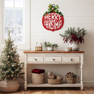 Merry Christmas red ornament sign displayed on farmhouse console with mini Christmas trees and holiday greenery